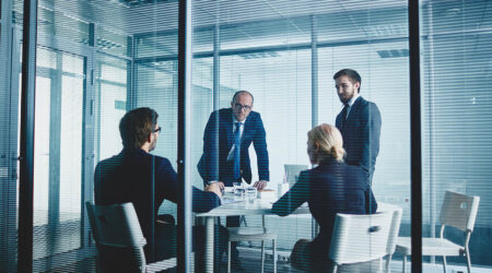 M&A Due Diligence & Integration M&A Professionals working in conference room
