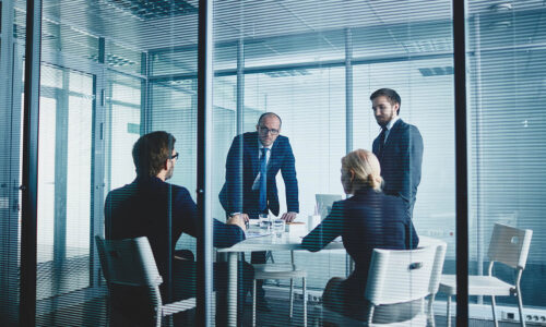 M&A Due Diligence & Integration M&A Professionals working in conference room