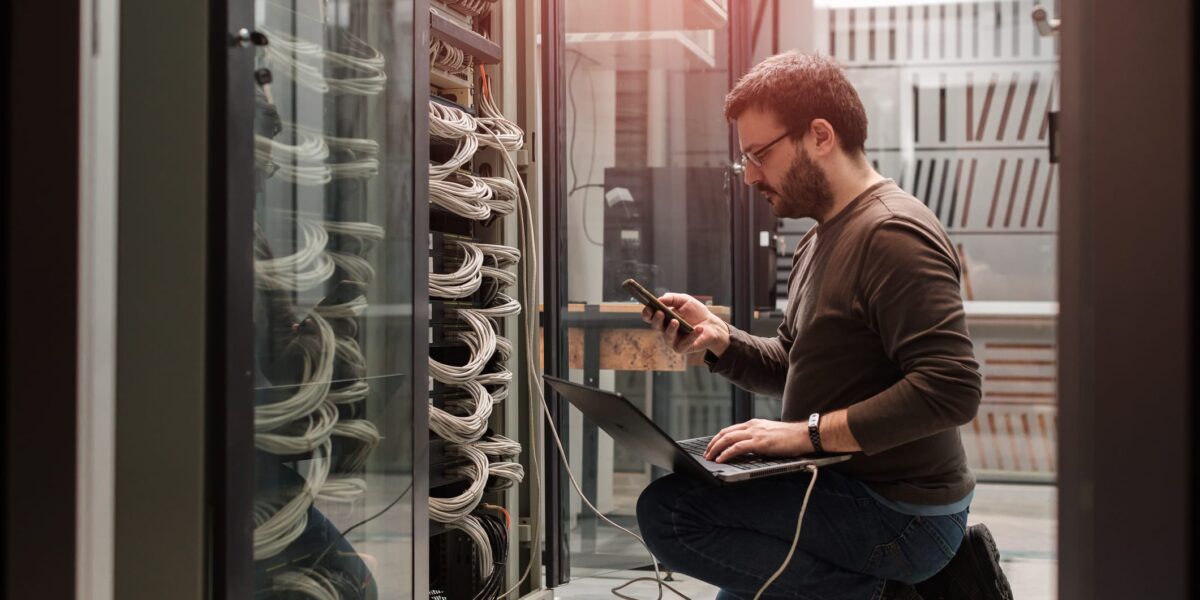IT professional working on network server equipment