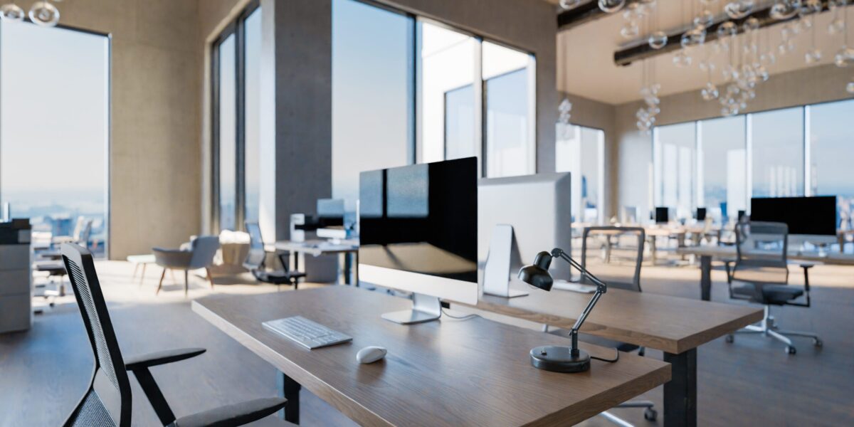 Large modern office with laptops