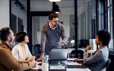 CTO & Consulting CTO Services IT Consulting Male Leader in conference room leading IT Strategy