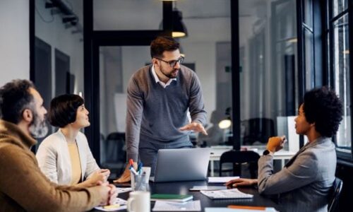 CTO Services IT Consulting Male Leader in conference room leading IT Strategy
