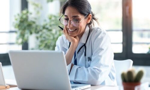 Female doctor working in front of computer