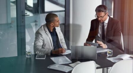 IT Consulting Meeting IT Consulting Meeting two people in conference room
