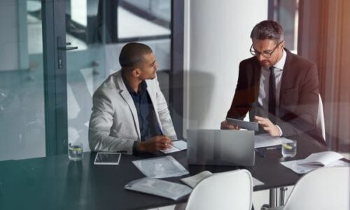 IT Consulting Meeting IT Consulting Meeting two people in conference room
