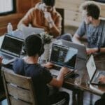IT Services For Technology & SaaS Group of developers working in laptop