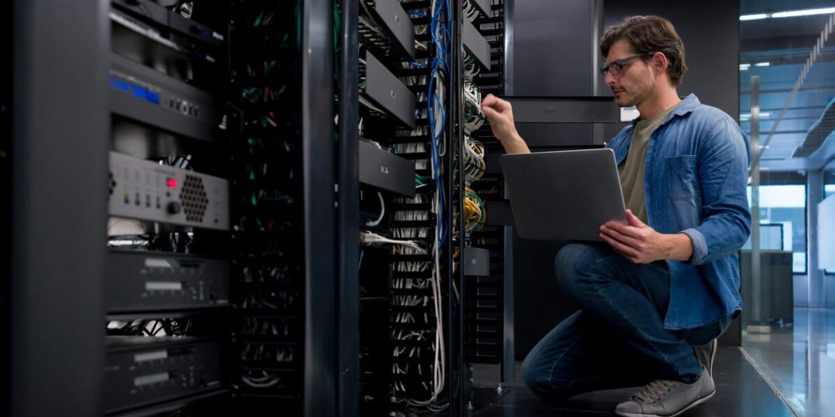 IT engineer working on network and server equipment
