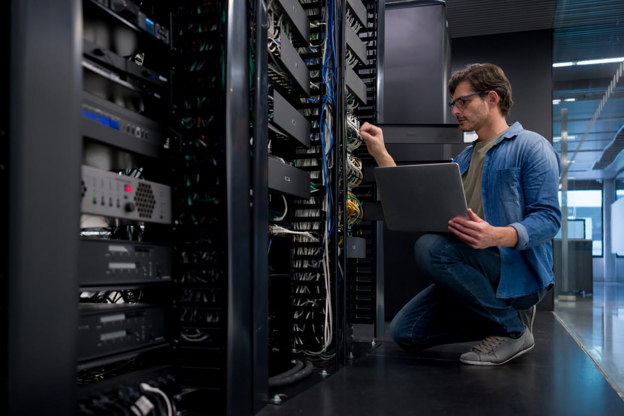 IT engineer working on network and server equipment