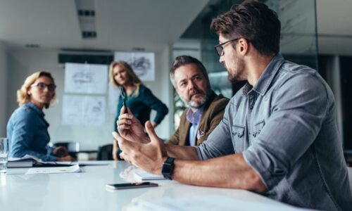 Businessman putting forward his suggestions to team Managed IT services company providing IT consulting to clients in conference room